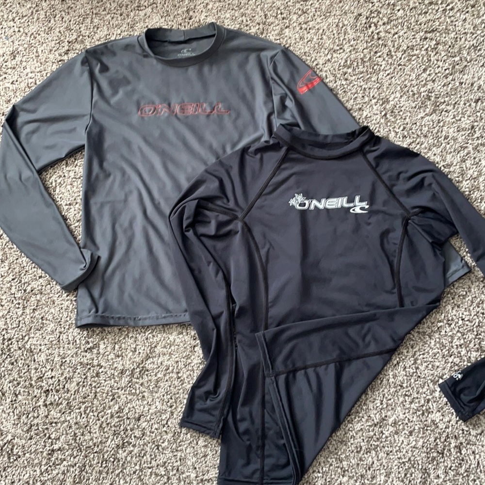 Bundle of two O’Neill rash guard/water shirts.